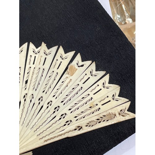 1185 - A 19th century hand painted ivory fan, length 18.5cm, and a bone arrow design fan with pierced decor... 