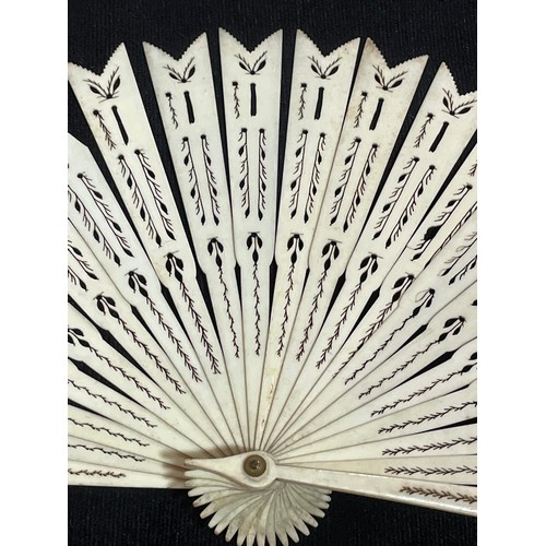 1185 - A 19th century hand painted ivory fan, length 18.5cm, and a bone arrow design fan with pierced decor... 