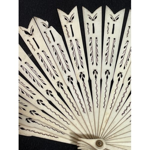 1185 - A 19th century hand painted ivory fan, length 18.5cm, and a bone arrow design fan with pierced decor... 