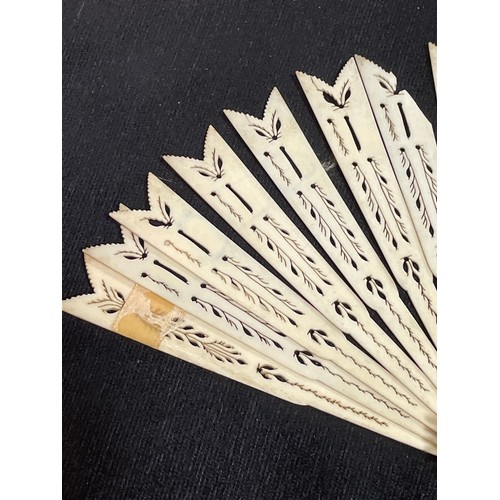 1185 - A 19th century hand painted ivory fan, length 18.5cm, and a bone arrow design fan with pierced decor... 