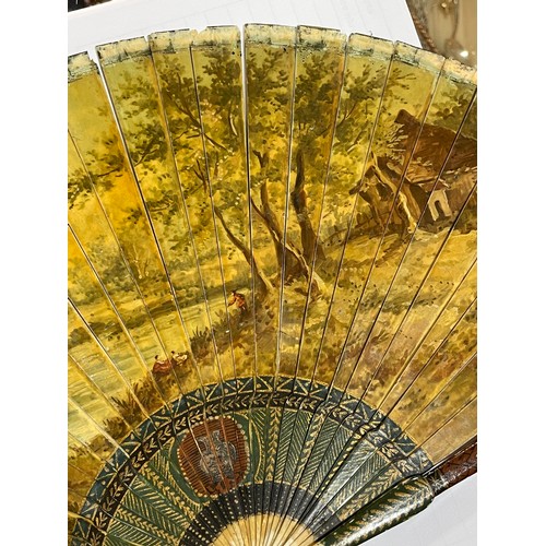 1185 - A 19th century hand painted ivory fan, length 18.5cm, and a bone arrow design fan with pierced decor... 