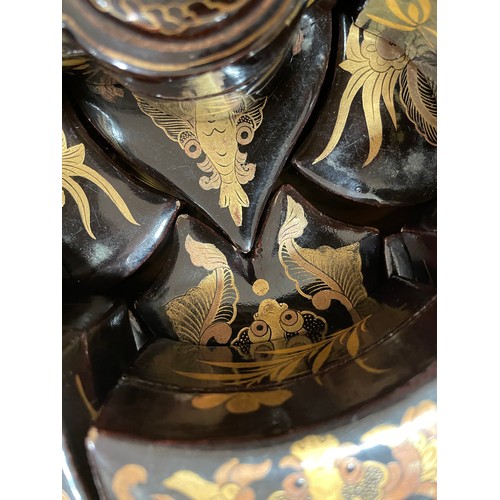 1052 - An unusual Chinese gilded and lacquered box in the form of a butterfly, the interior fitted with nes... 