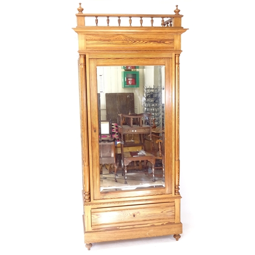 2076 - WITHDRAWN A French pitch pine armoire, with fitted shelves and single bevel-glazed door, with drawer... 