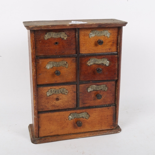 132 - A small oak table-top spice bank of drawers, W22cm, H26cm, D9cm