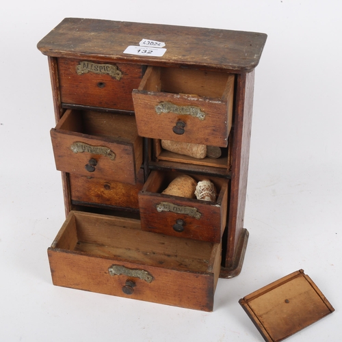 132 - A small oak table-top spice bank of drawers, W22cm, H26cm, D9cm