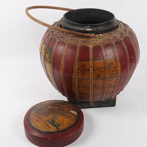 152 - An Oriental lacquered caned and painted food carrying vessel, height 30cm