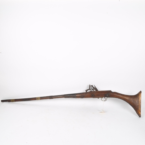 174 - A Persian Kabyle Snaphaunce muzzle loading musket, length 117cm, and a child's toy gun (2)