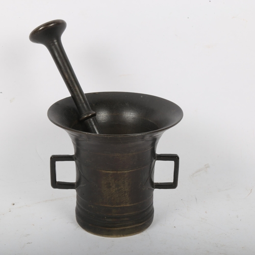 192 - An Antique polished bronze pestle and mortar, mortar height 12cm