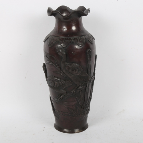 203 - A Japanese patinated bronze vase, relief bird decoration, height 31cm, lacking base