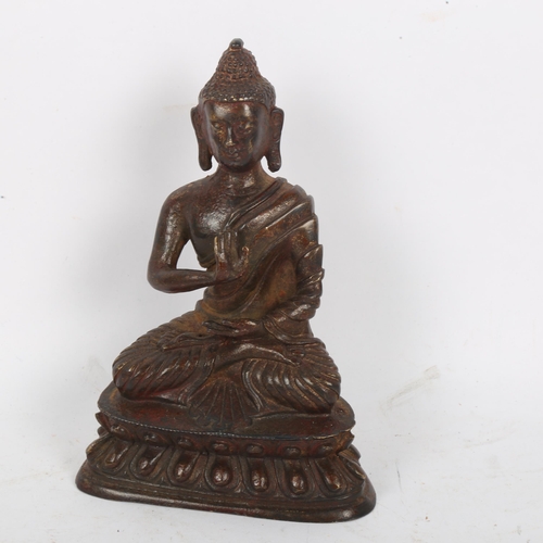 205 - A Chinese patinated and gilded bronze seated Buddha, on double lotus base, height 15cm