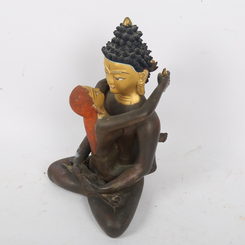 212 - A Chinese hand painted and gilded patinated bronze seated Buddha figure, height 23cm