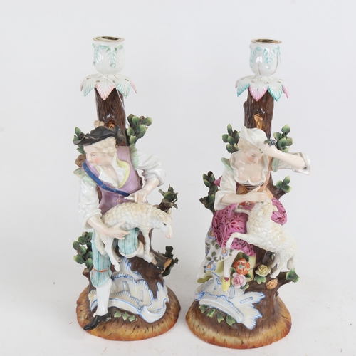 444 - A pair of German porcelain candlesticks, surmounted by shepherd and shepherdess figures, Augustus Re... 