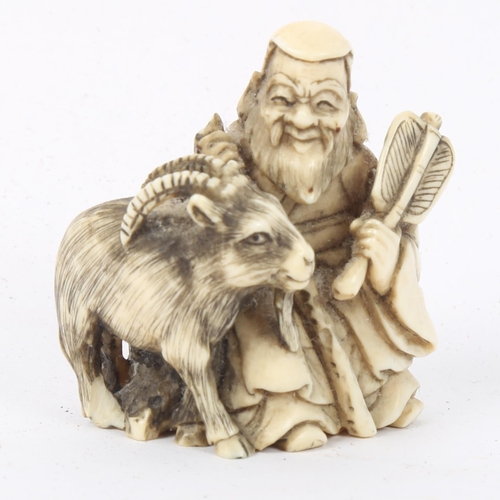 266 - A Japanese carved ivory netsuke, shepherd with goat, signed, height 4cm