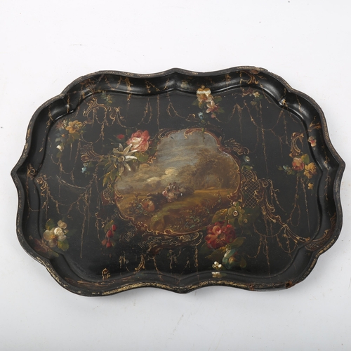 271 - A Victorian Japanned papier mache tea tray, hand painted and gilded decoration with landscape scene,... 