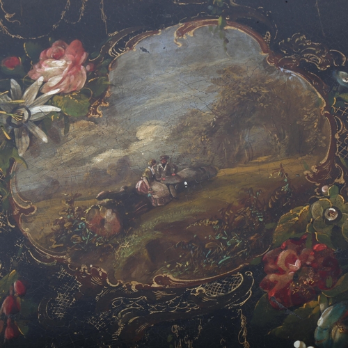 271 - A Victorian Japanned papier mache tea tray, hand painted and gilded decoration with landscape scene,... 