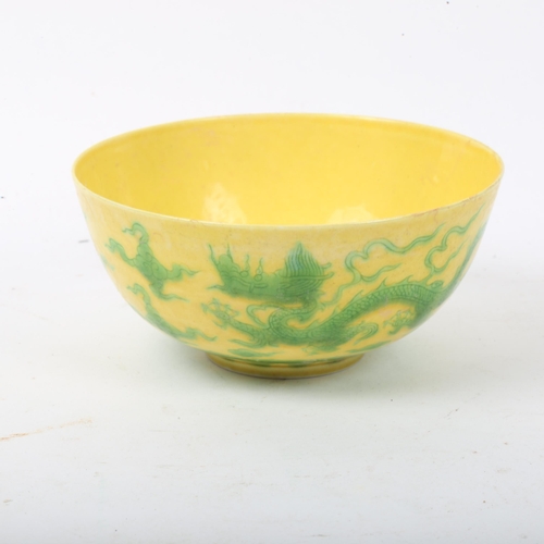 282 - A Chinese yellow ground green glaze 'dragon' bowl, 6 character mark, diameter 12cm