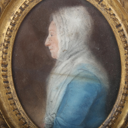 283 - A miniature portrait, female profile, gilt-metal oval frame, overall height 16cm