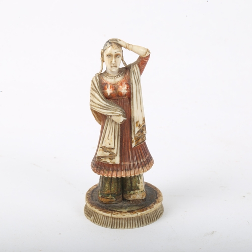 287 - A 19th century Indian hand painted and gilded ivory figure/chess piece, signed, height 8cm