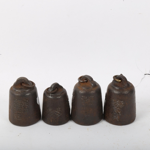 291 - A set of 4 Japanese balance scale weights, with character marks, largest height 6cm