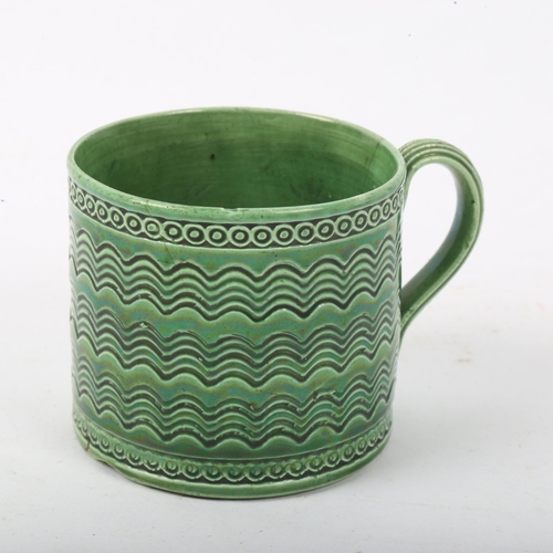 293 - A Rye Pottery green glaze tea cup, height 6cm