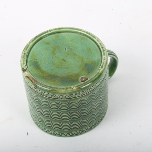 293 - A Rye Pottery green glaze tea cup, height 6cm