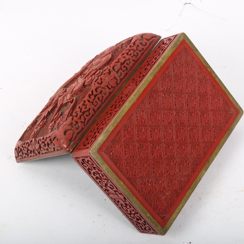 300 - A Chinese red cinnabar 'dragon' box, 15cm x 10cm