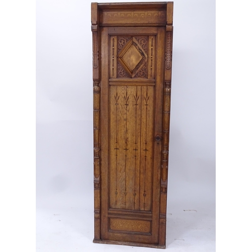 2011 - A Victorian Arts and Crafts hall cupboard, with a single carved and panelled door, W60cm, H192cm, D6... 