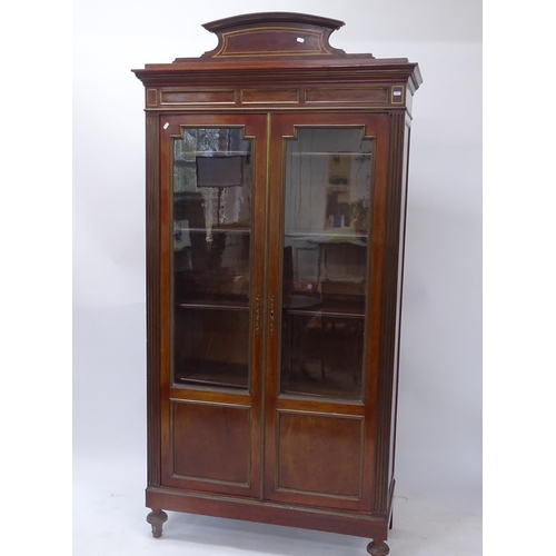 2013 - An Antique mahogany bookcase, with 2 glazed doors and panelled doors, adjustable shelves, and allove... 