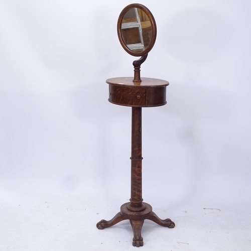 2017 - An early 20th century oak shaving mirror, with single drawer on turned column and lion paw feet, H15... 