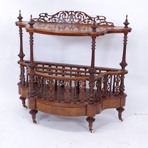 2021 - A Victorian figured walnut serpentine whatnot/Canterbury, with pierced fretwork panels, spiral turne... 