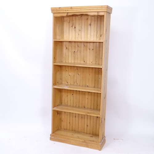 2022 - A polished pine open bookcase with fitted shelves, W75cm, H102cm, D25cm