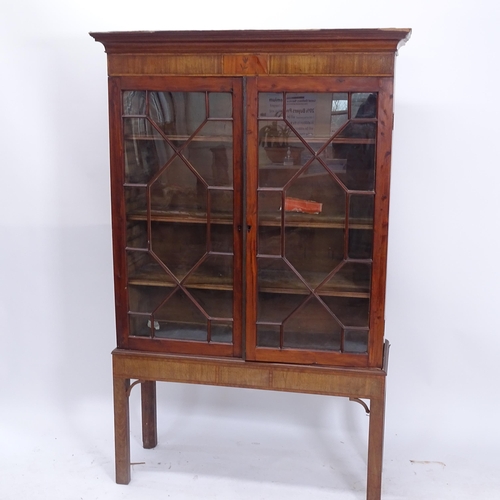 2027 - An Antique mahogany and satinwood-banded 2-door bookcase on stand (A/F), W104cm, H163cm, D34cm