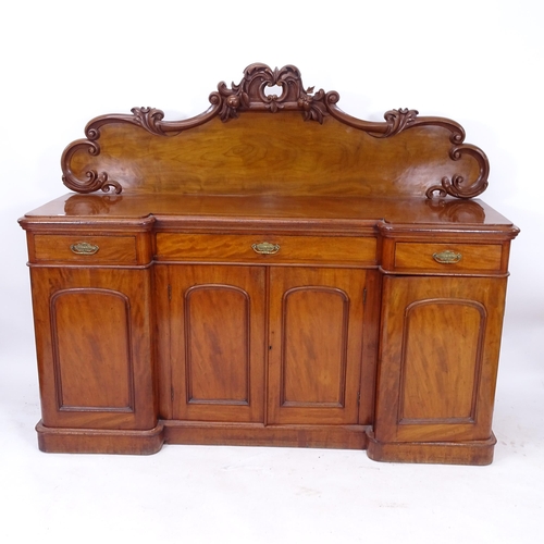 2085 - A Victorian mahogany inverted break-front sideboard, with raised carved back, 3 frieze drawers, and ... 