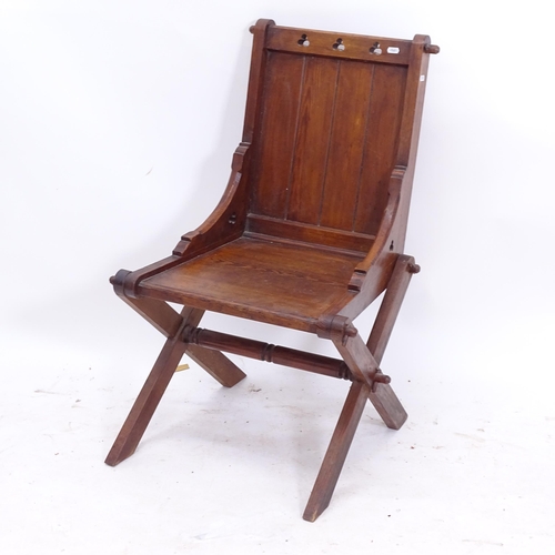 2091 - A Victorian Gothic pine hall chair, with stylised pierced decoration