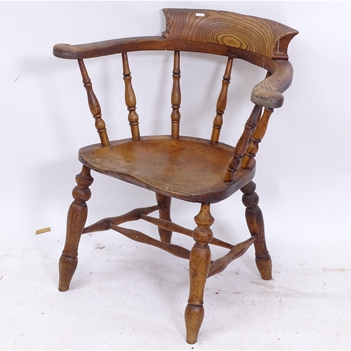 2093 - A 19th century elm-seated bow-arm chair