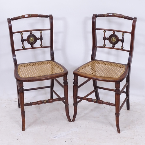 2169 - A pair of Antique simulated rosewood side chairs, with brass detail and cane panelled seat, on turne... 