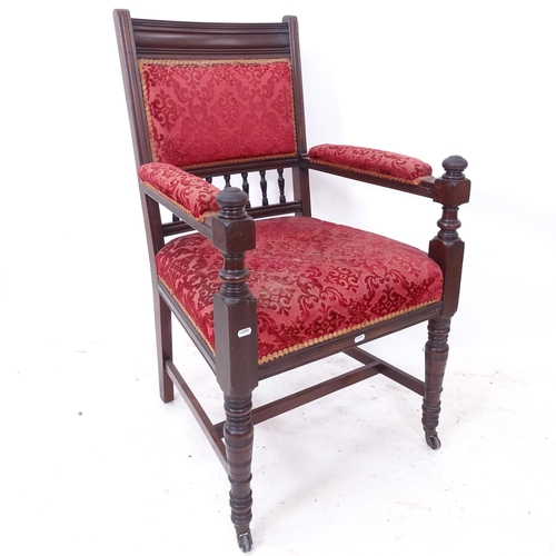 2255 - A Victorian mahogany upholstered desk chair, on turned legs