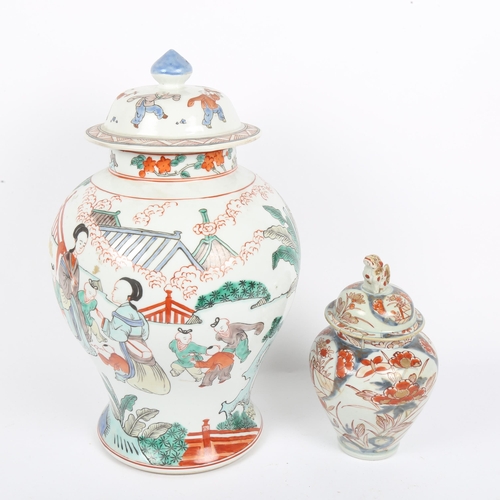 348 - A large Chinese porcelain jar and cover, with painted figures, height 40cm, and a smaller Chinese Im... 