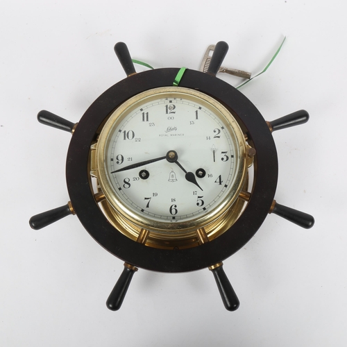 349 - A German Schatz Royal Mariner 8-day ship's brass bulkhead clock, in ship's wheel surround, overall d... 