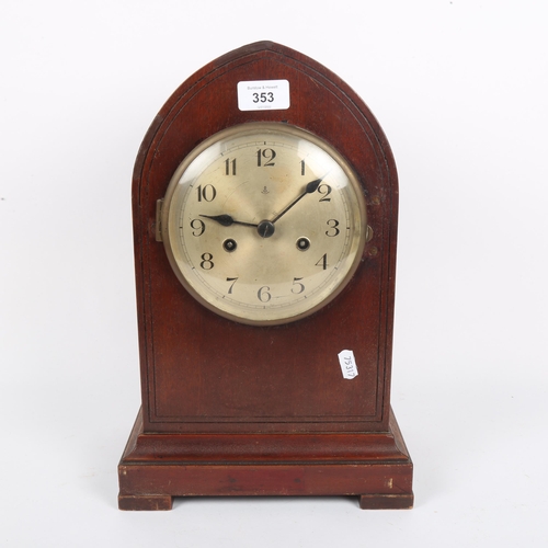 353 - A German oak 8-day lancet-top mantel clock, silvered dial with Arabic numerals, and movement strikin... 