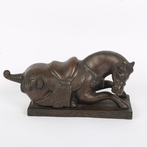 356 - A Chinese patinated bronze recumbent horse sculpture, signed, length 29cm