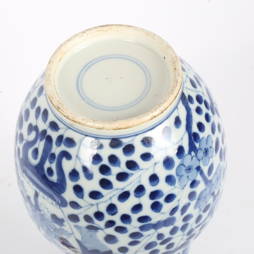 363 - A Chinese blue and white double-gourd vase, figural and floral decoration with jars, height 29cm