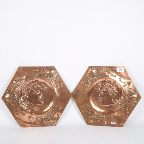 373 - A pair of Art Nouveau Newlyn style hexagonal copper plaques, relief embossed figural and floral deco... 