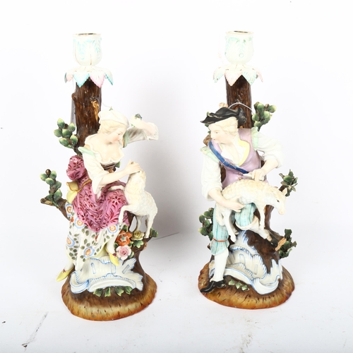 444 - A pair of German porcelain candlesticks, surmounted by shepherd and shepherdess figures, Augustus Re... 