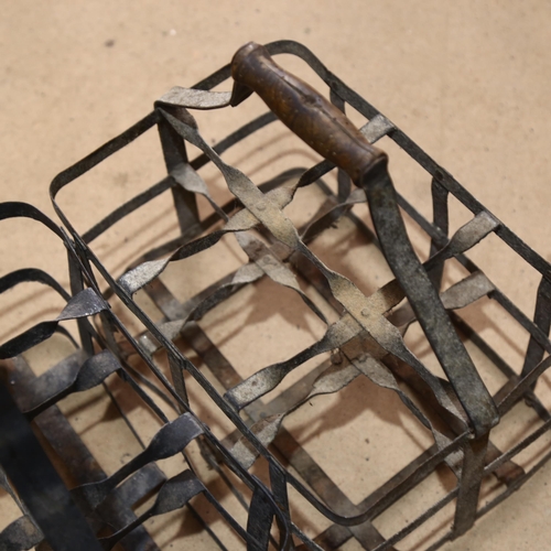 569 - 2 Vintage wrought-iron 6-section bottle carriers