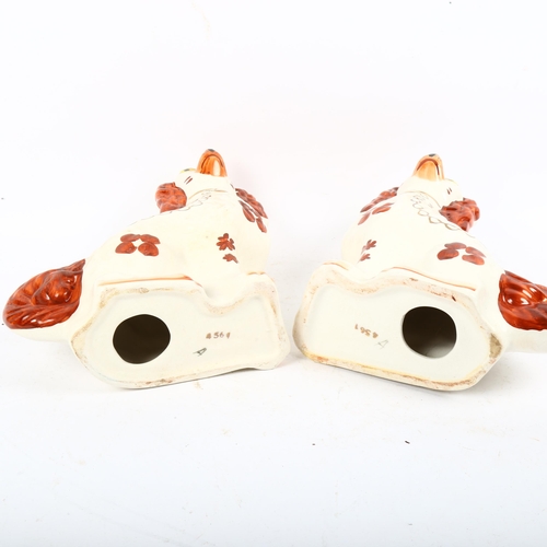 577 - A pair of Staffordshire fireside Spaniel figures, height 29cm