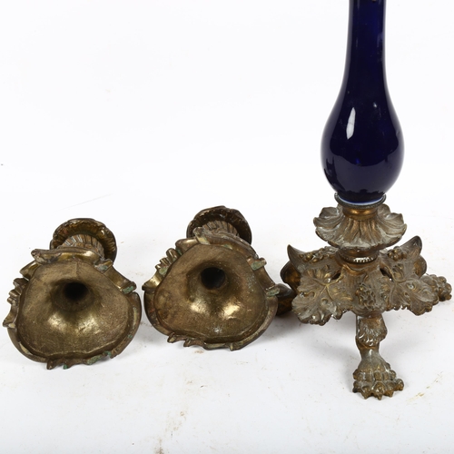 579 - A 19th century French blue glaze ceramic ormolu table candlestick, and a similar pair of squat candl... 