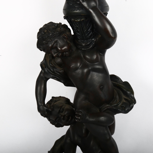 585 - A large bronzed resin figural putti table lamp, height 70cm