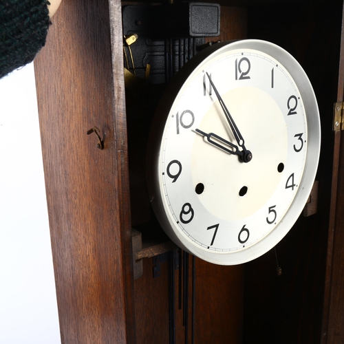 639 - An oak-cased 8-day chiming wall clock, height 80cm