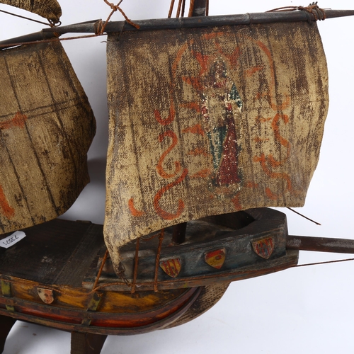 685 - A painted wooden galleon on stand, height 54cm